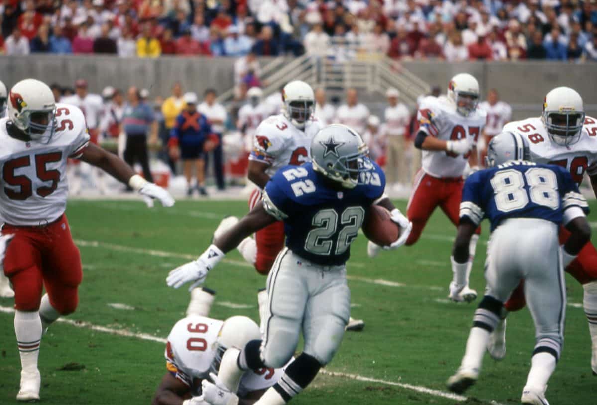 Emmitt Smith eludes the tackle of Tyronne Stowe during the Dallas Cowboys' 16-10 victory over the Phoenix Cardinals on Nov. 22, 1992 at Sun Devil Stadium in Tempe, AZ. Photo by Richard Paolinelli.